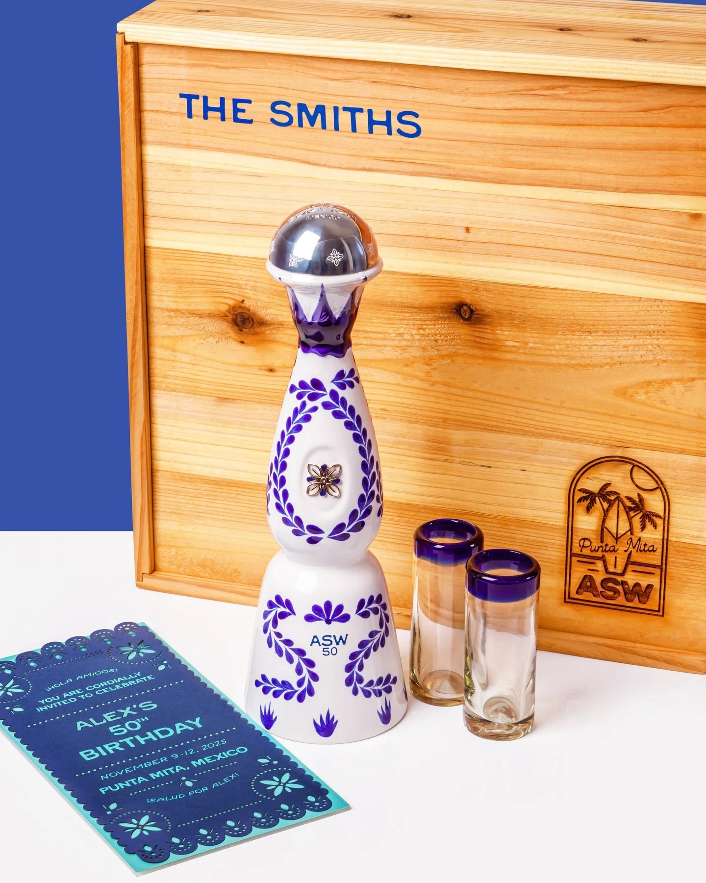 When a friend asks you to help celebrate their 50th in Punta Mita, you go all in.

We designed and produced a complete custom gift suite &mdash; branded shipper box, laser-engraved wood keepsake box, blue velvet inlay, shot glasses, and a hand-cut pa