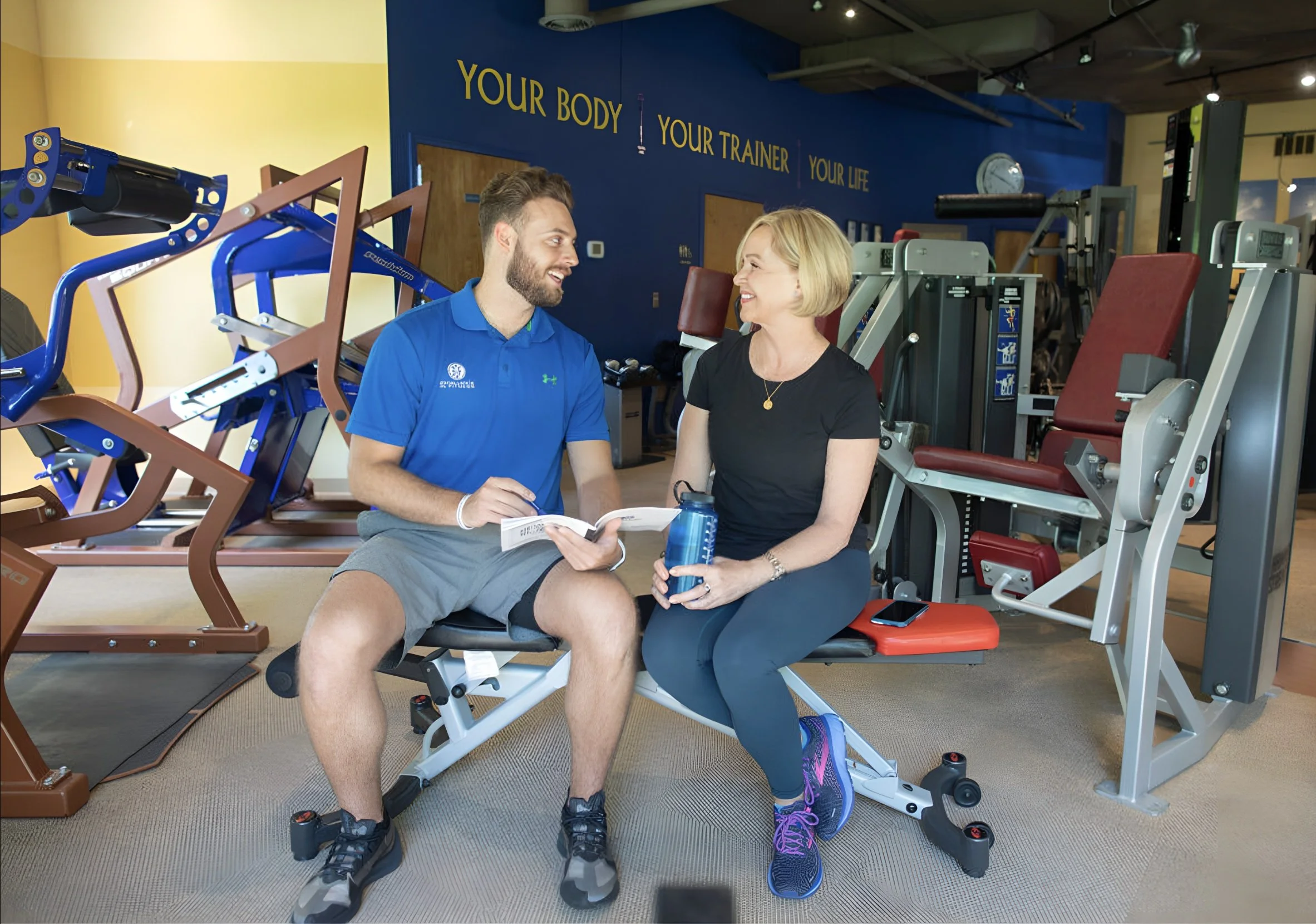 Personal trainer providing individualized strength coaching during a private session in Millersville, Maryland.