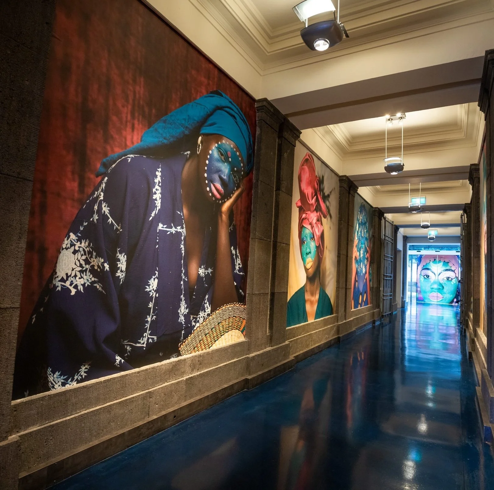 Aerial view of the iconic XXXX Brewery in Milton, Brisbane. The large red-brick industrial building features the “Milton Brewery” signage, a cartoon character holding a beer, and prominent XXXX branding on the rooftop and beer tanks.