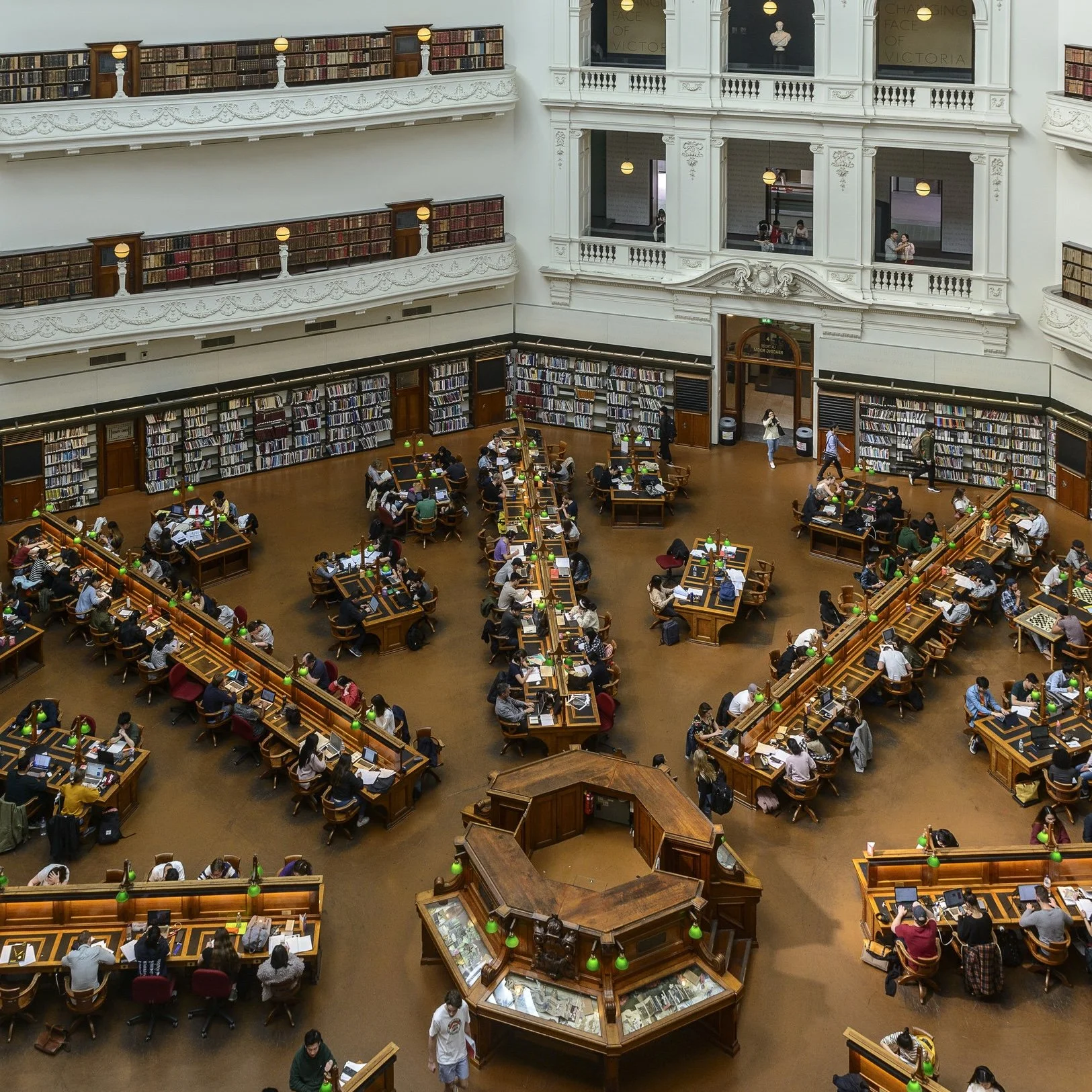 Aerial view of the iconic XXXX Brewery in Milton, Brisbane. The large red-brick industrial building features the “Milton Brewery” signage, a cartoon character holding a beer, and prominent XXXX branding on the rooftop and beer tanks.