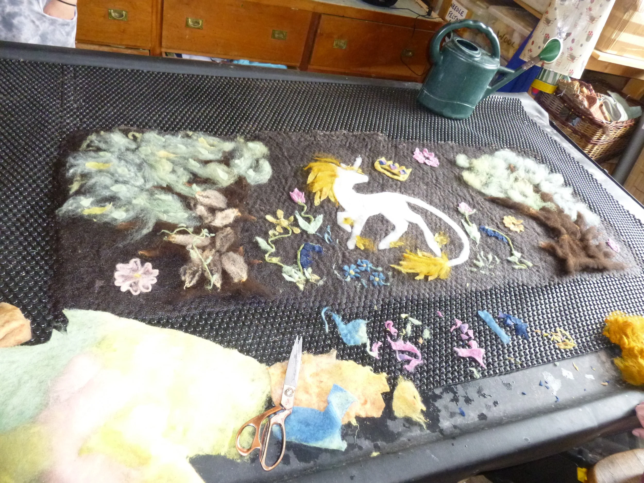 Felting student's art work in process
