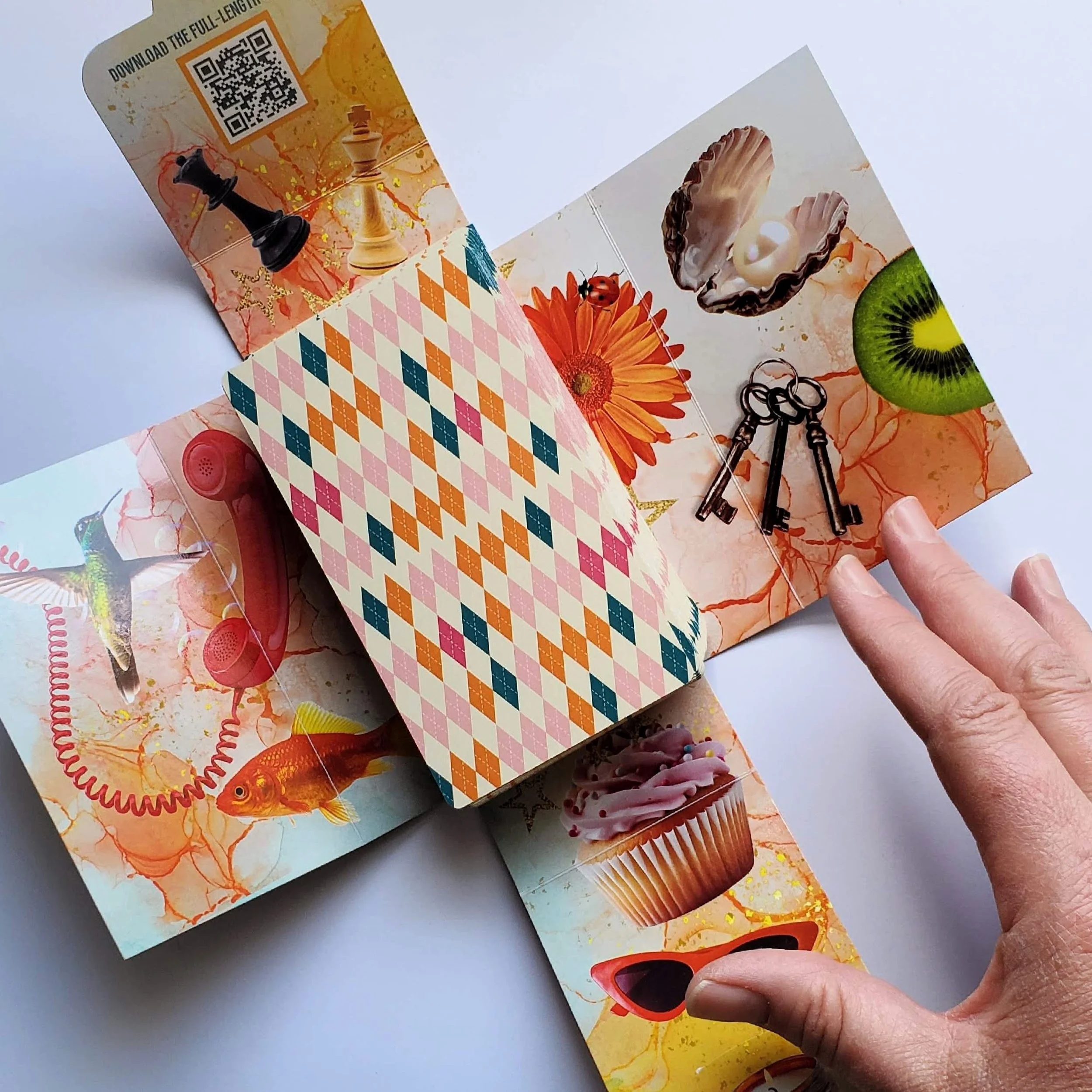 How Did I Get Here Tarot cards open box with hand showing colorful pop art collage backs — indie tarot deck by S.G. Stasi Designs