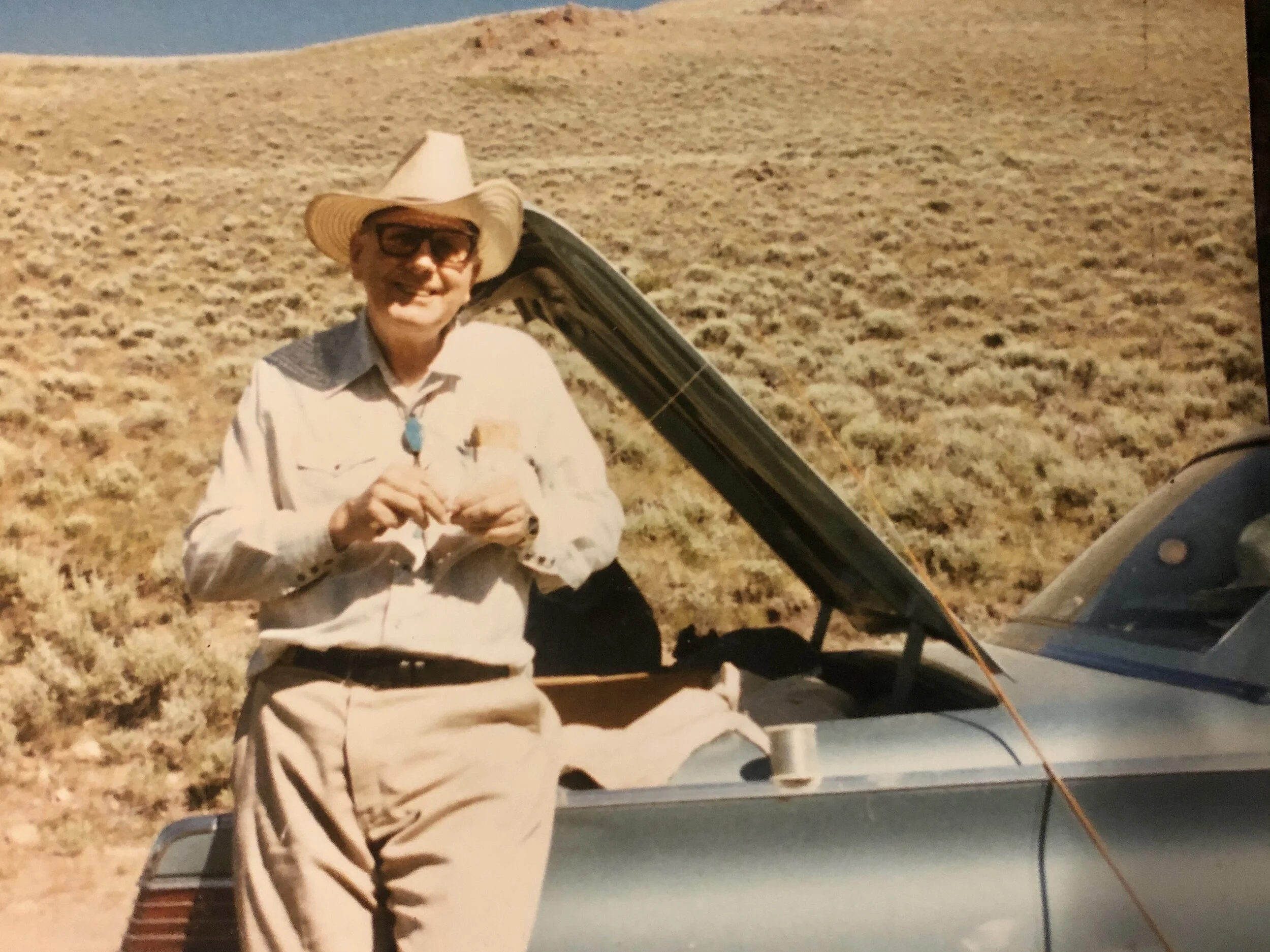 My dad wearing his favorite turquoise bolo tie and fly fishing at his happy place in Mackay, Idaho.