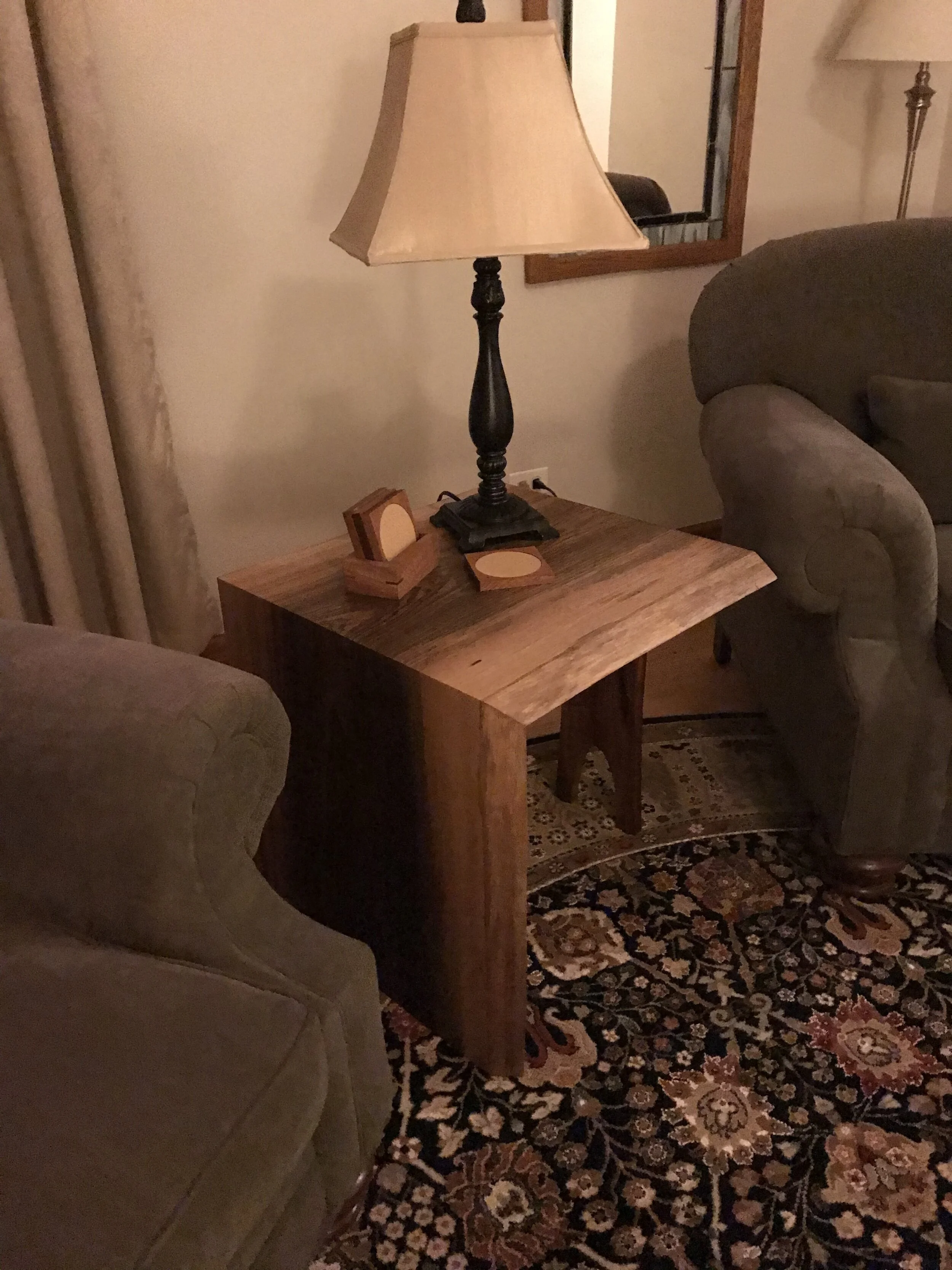 Waterfall side table made from a sapele live edge wood slab