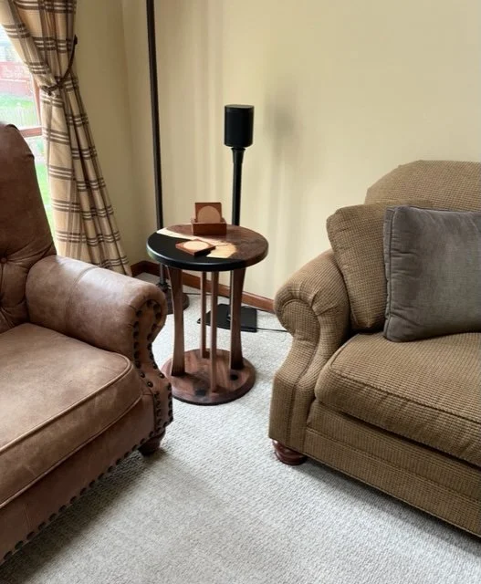 18" Round walnut and black resin table. 