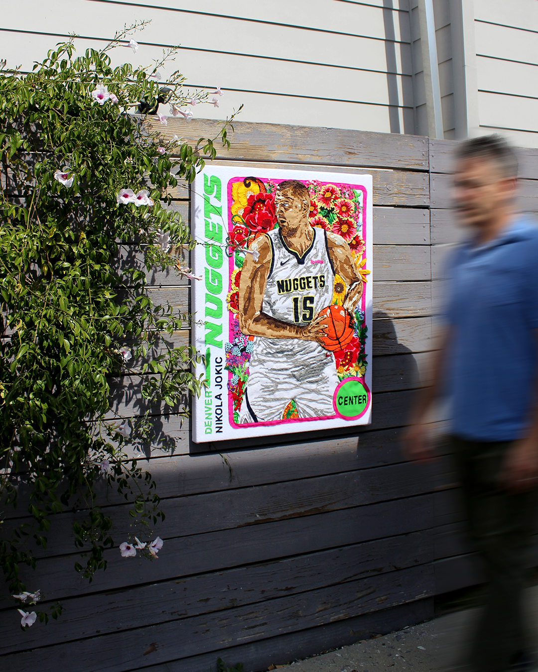 nikola jokic flowers tapestry on outside fence 1.png