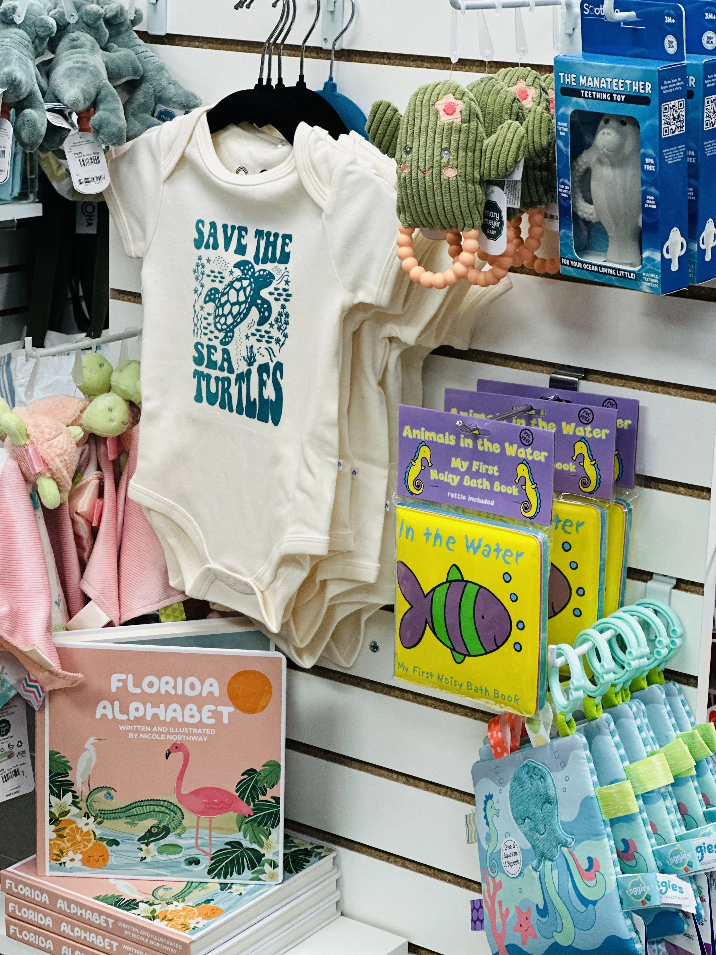 photo of infant wear in the children's gift section of the Owl's Roost gift shopts