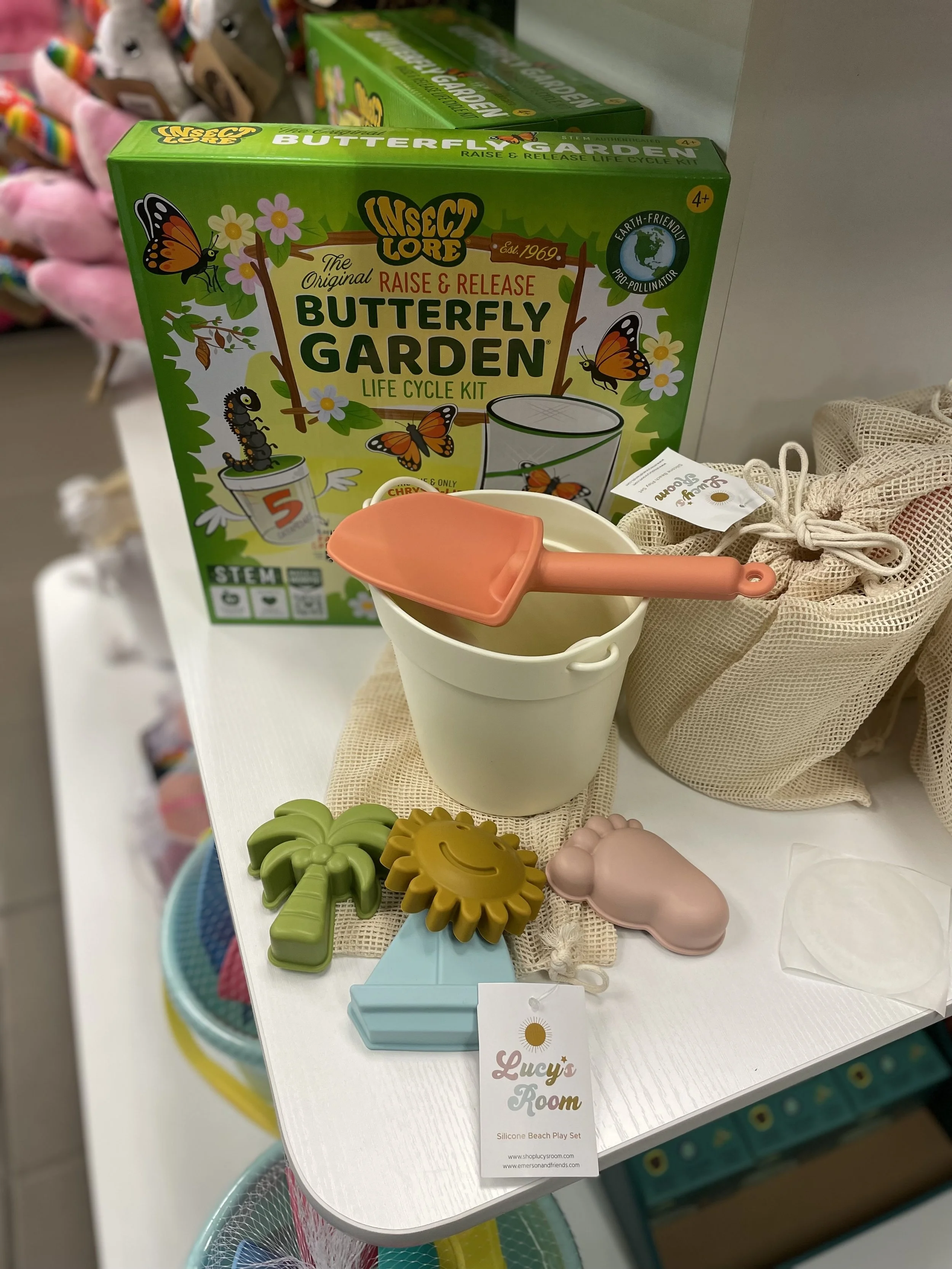 bucket and shovel beach toys on shelf at owl's roost gift shop