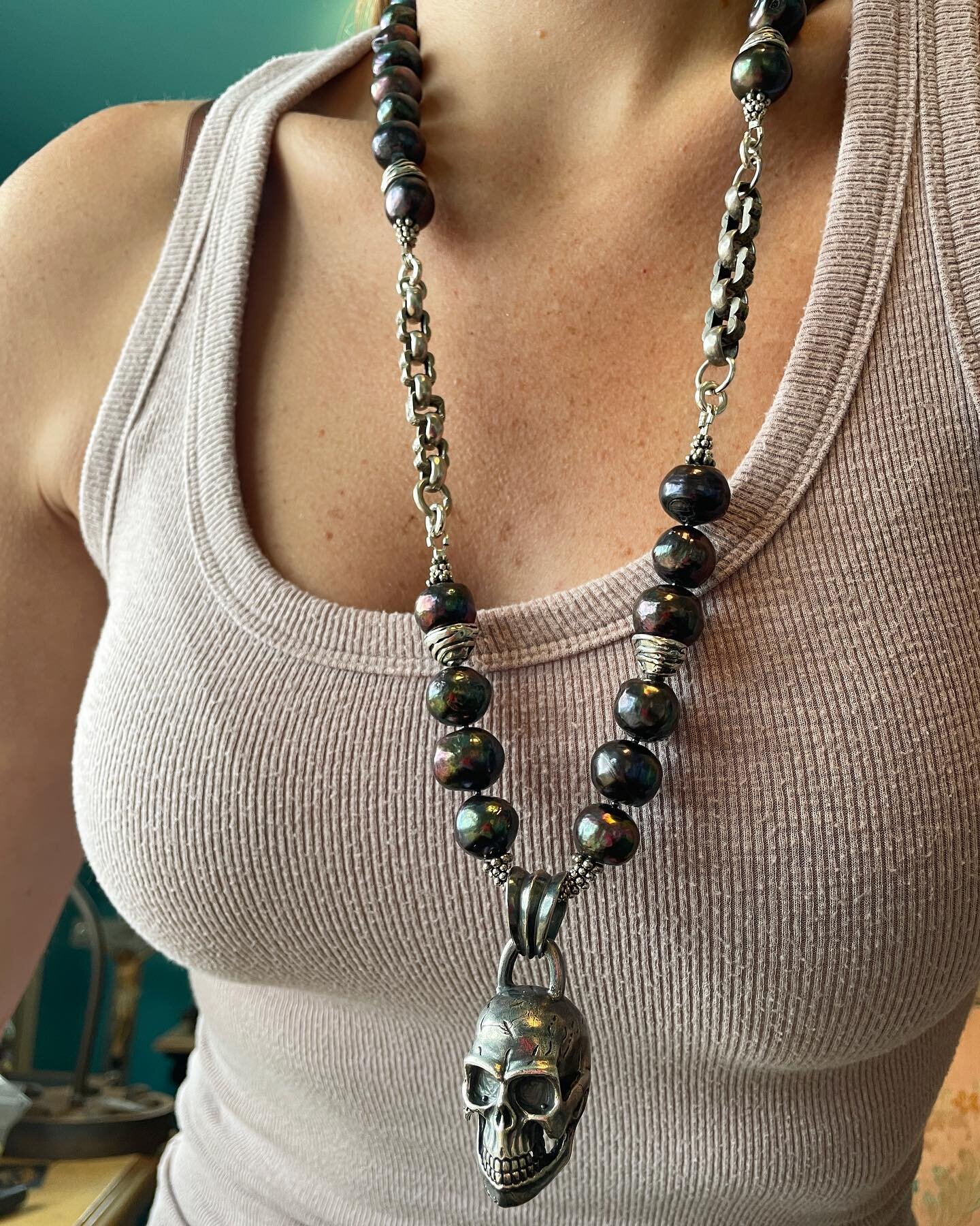 Make a statement when you wear this large Sterling skull pendant that drops from Sterling capped purple/grey/green freshwater pearls and two antique Sterling fancy watch chains circa. 1880! 💀✨

#luxerockline #luxury #rockstyle #skulljewelry #skullar