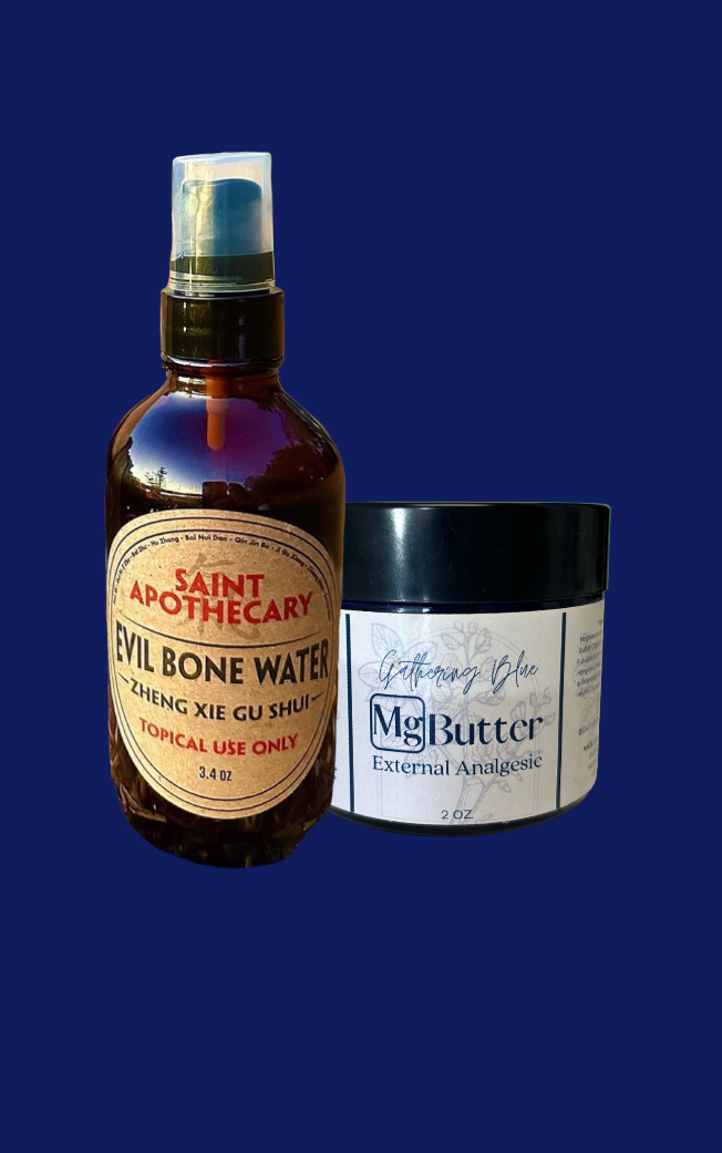A spray bottle labeled 'Saint Apothecary Evil Bone Water' and a jar labeled 'Captivating Blue Mg Butter External Analgesic' are placed against a dark background.