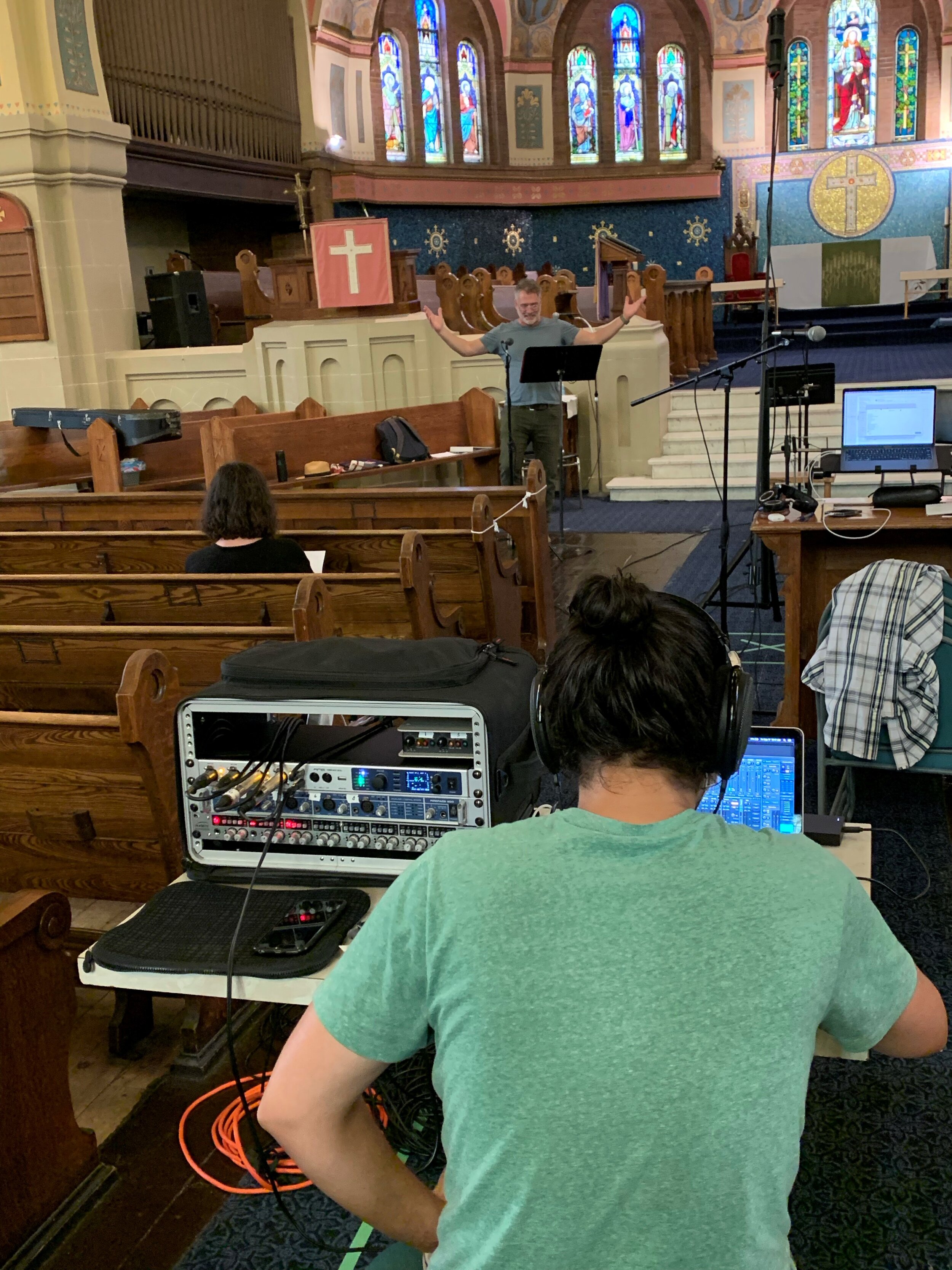 Matt Antal, sound engineer, and Deanne Williams, dramaturg, listen to Paul Hopkins as a pompous Comus.