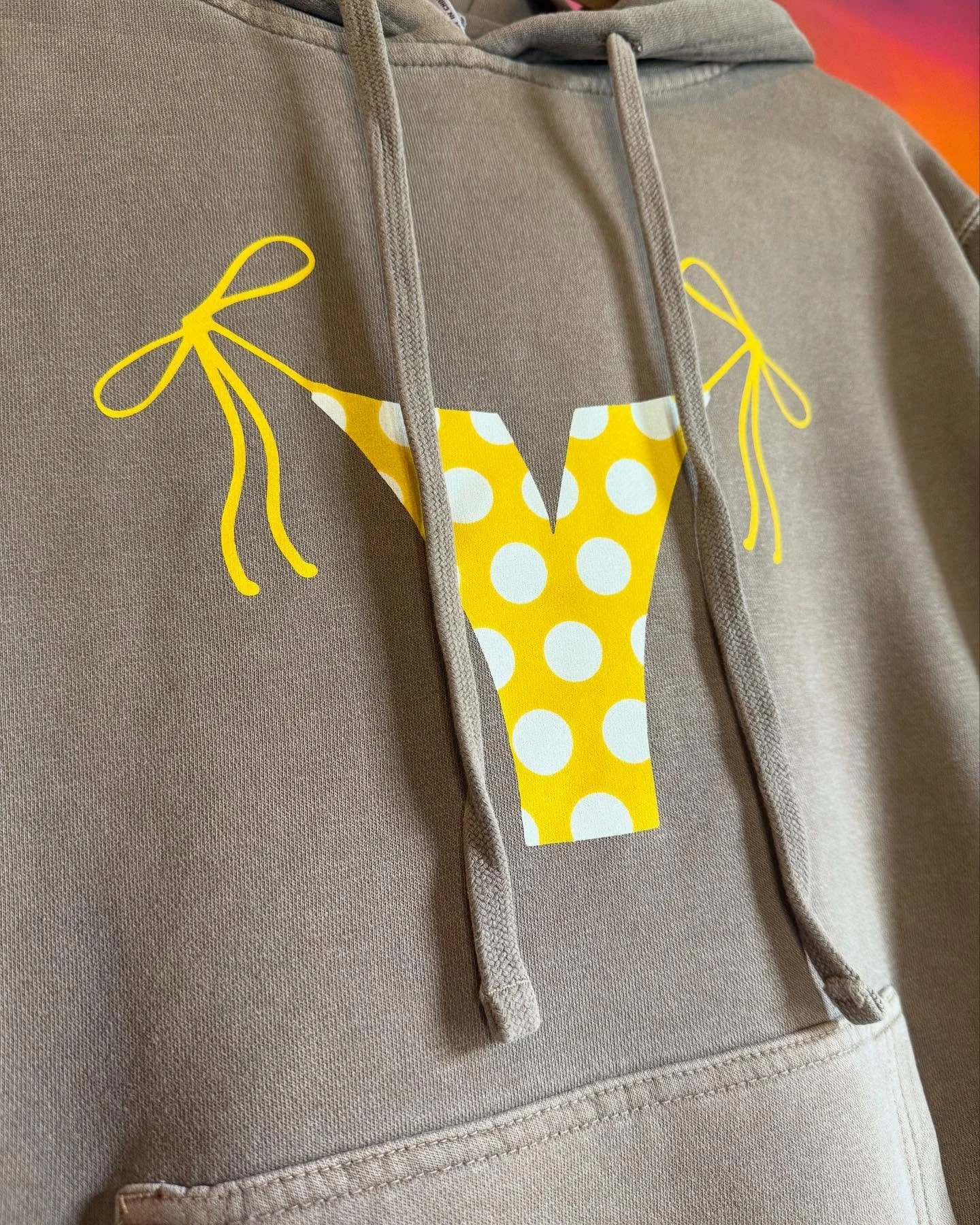 It’s not quite hoodie weather yet, but it might be hoodikini weather (that’s totally a thing - probably). Grab one of these limited-edition yellow polka-dot bikini vibe hoodies dropping today.