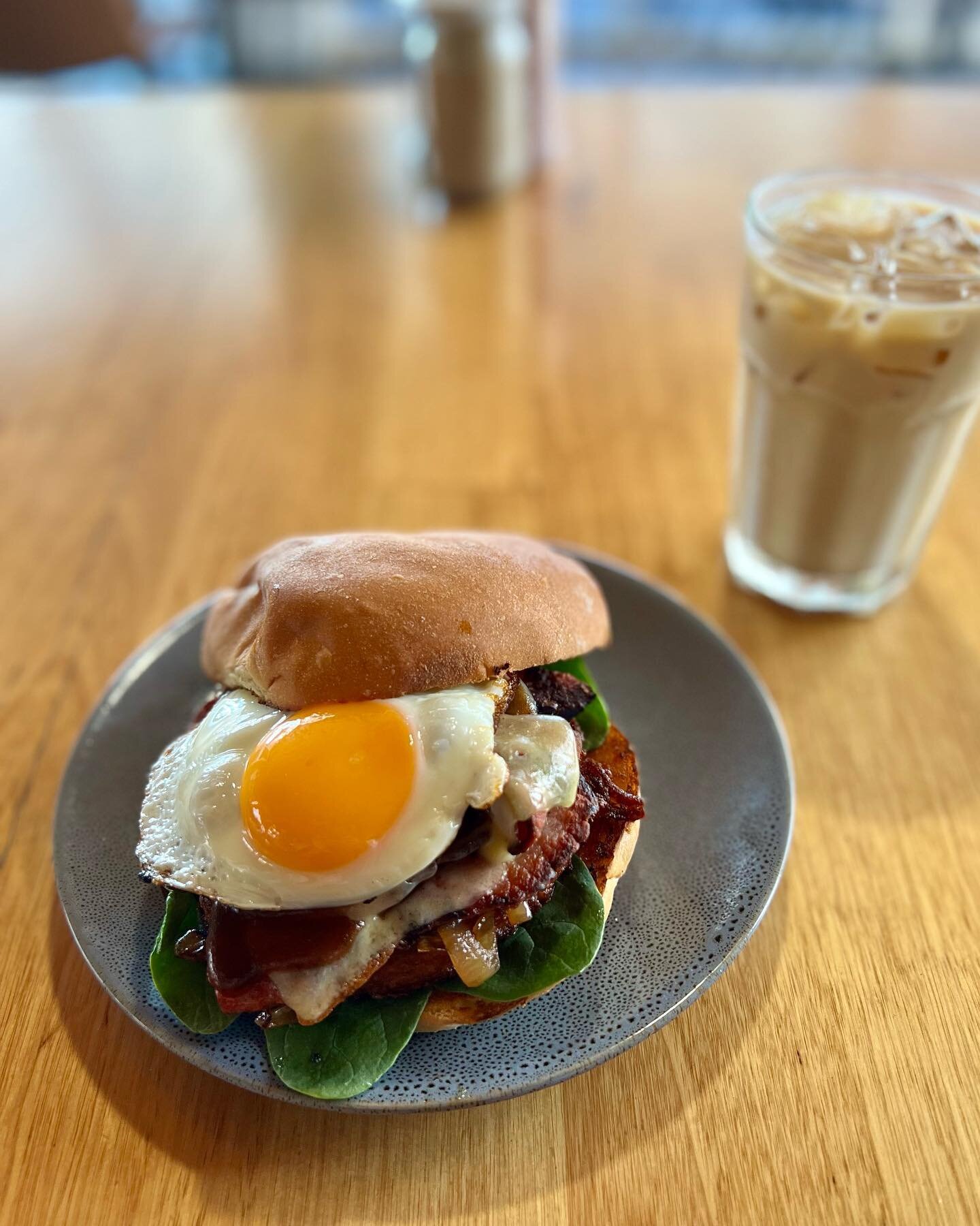 Breaky burger special on this week  Bacon egg roll with caramelised onion, house made potato Rosti, baby spinach, cheese and BBQ sauce  Goes great with or new oat cold brew coffee #breakyburger #breakfast #cokdbrew #tuncurry #forster #barringtoncoast