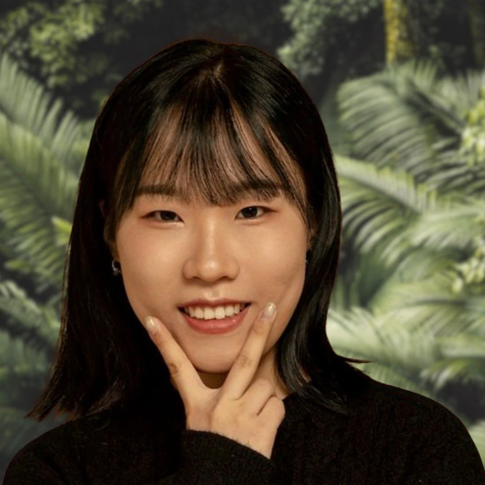 Woman smiling with forest background