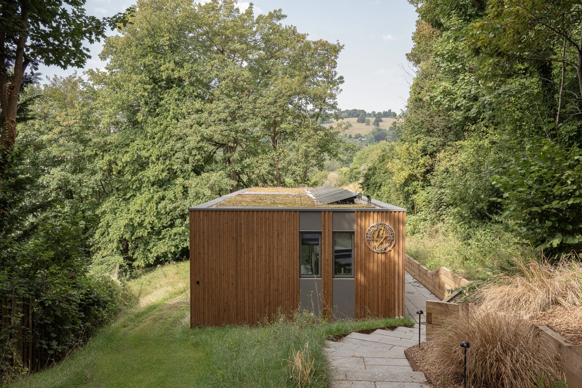 Approach to new timber and zinc clad new dwelling set into Bath hillside