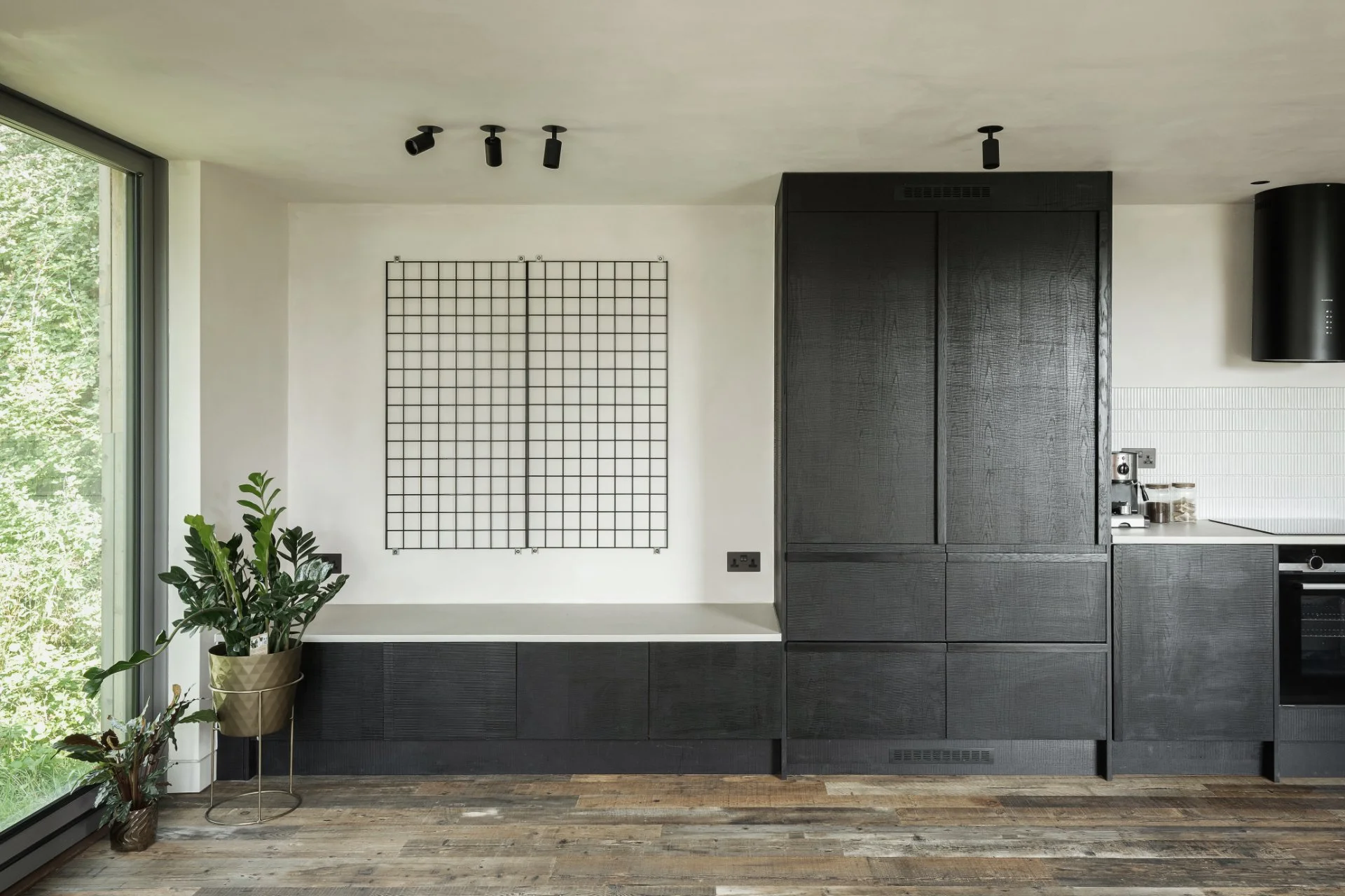 Black joinery, window frames and fittings create contemporary new kitchen
