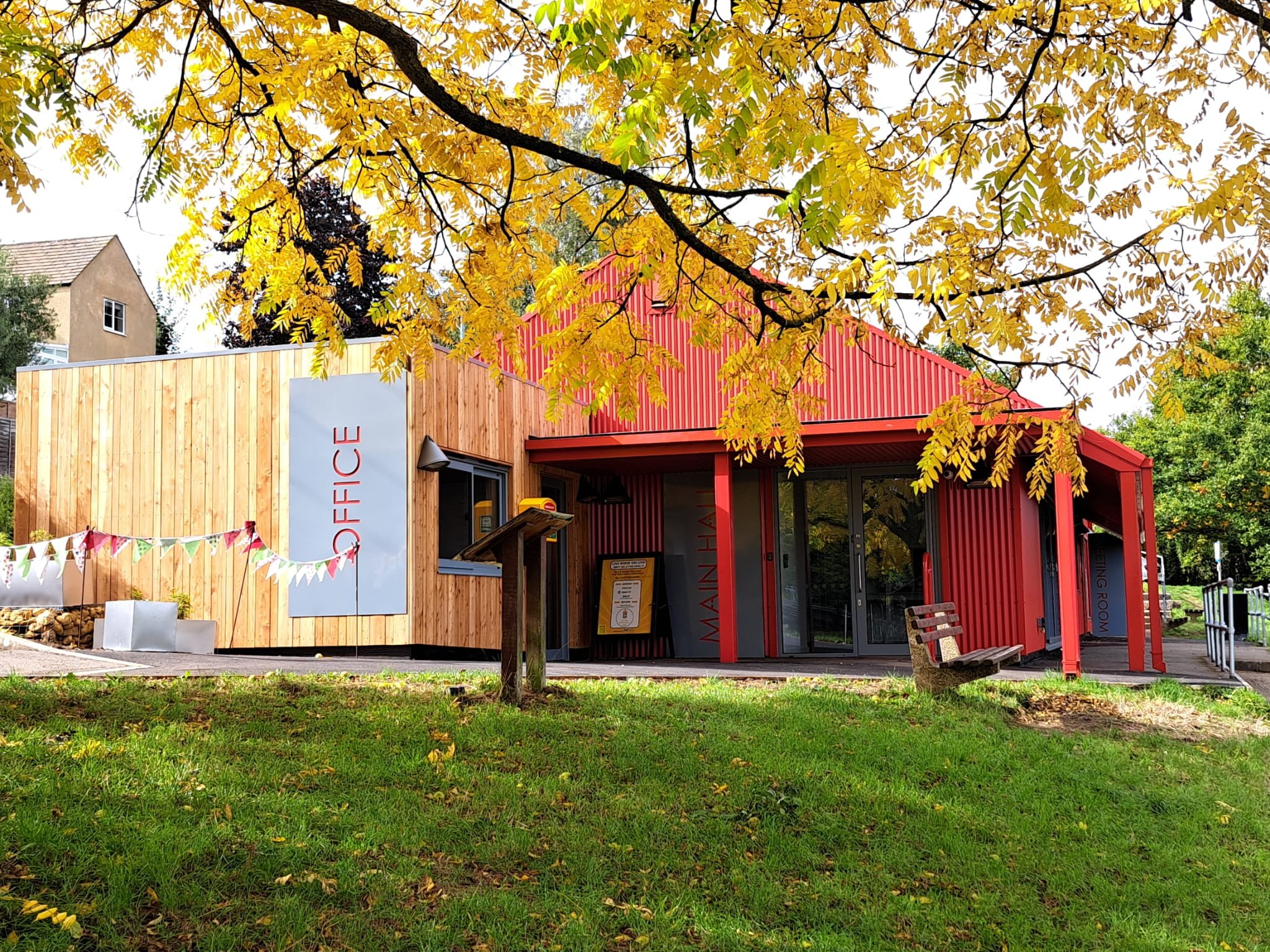 Rodborough Community Hall new bright red metal and timber clad front entrance
