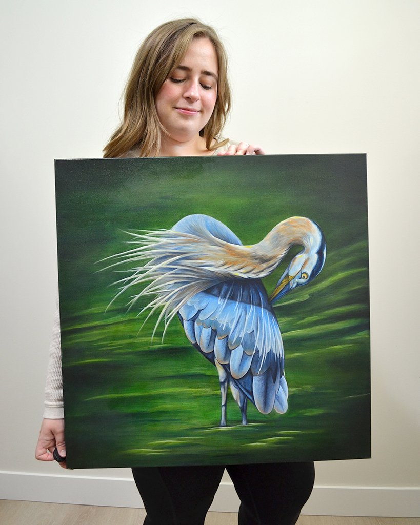 There is a profound serenity in the heron's solitude as it stands on the water's edge, the picture of patience and grace. The blue heron embodies the beauty of quiet, calm and reflection in the ever-changing tapestry of nature.

&quot;Solitude&quot;,