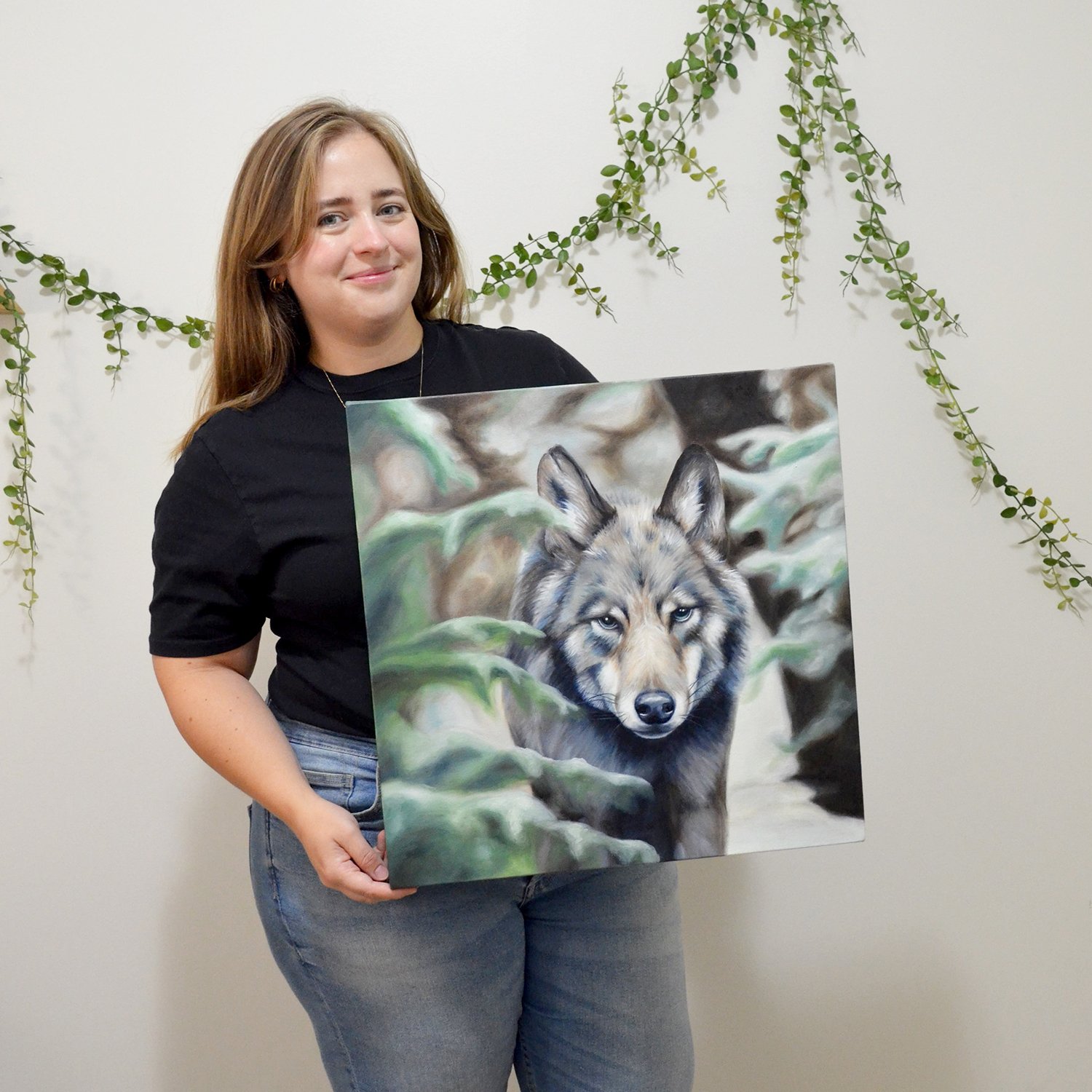 Vancouver Island artist Sarah Bergeron with Wolf oil painting