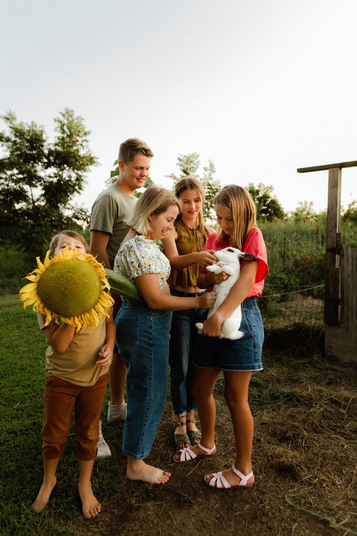  kids loving on bunny and playing outside 