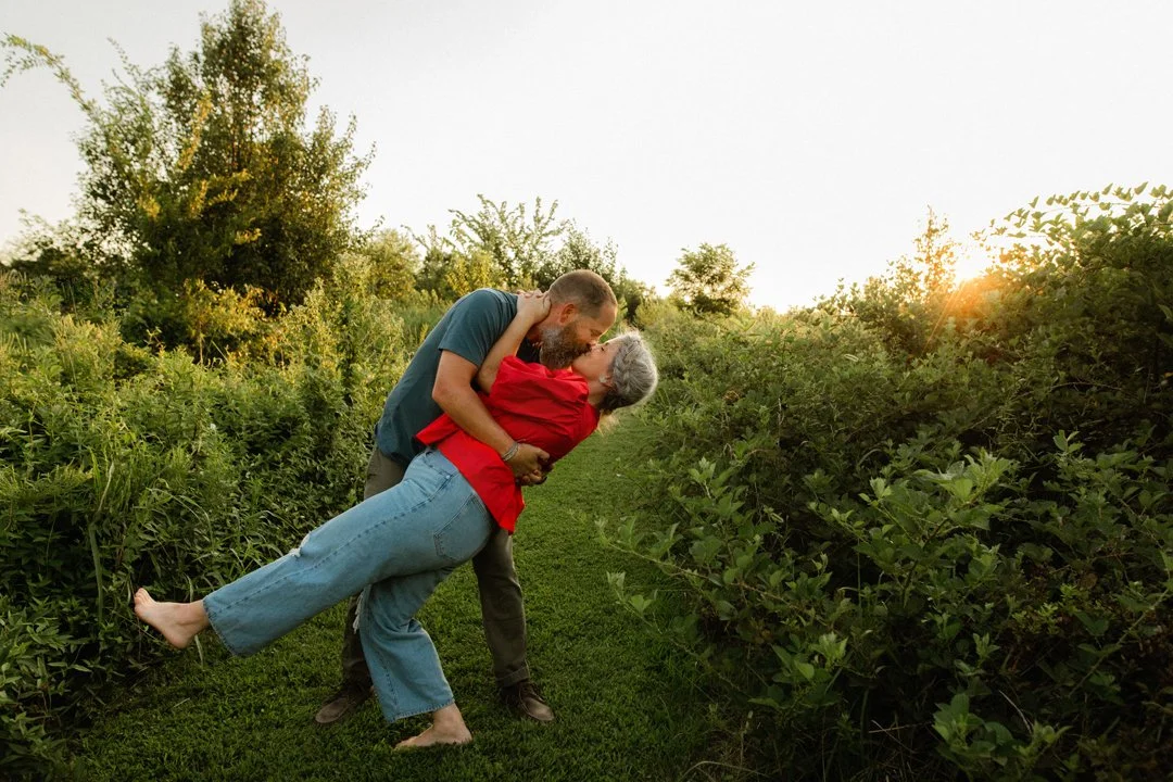  dad dipping mom in a field 