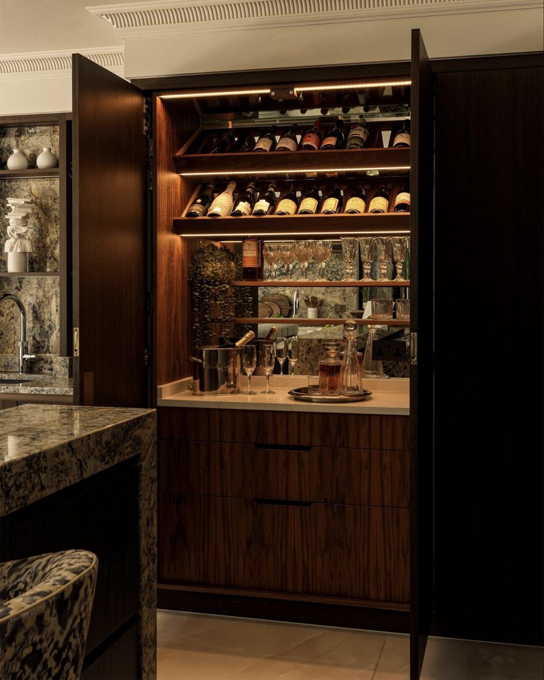There&rsquo;s always a point in the evening when this cabinet becomes the place everyone drifts toward. The doors open, the lighting comes on, and the whole room softens a little. Bottles sit within easy reach, the glasses are ready to go, and it nat