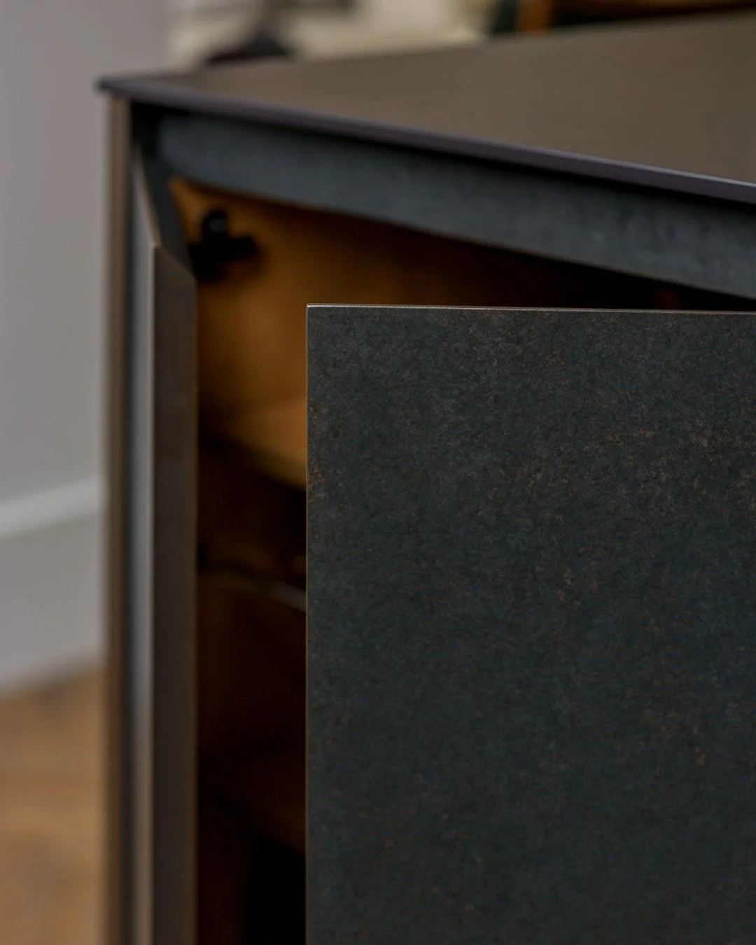 These interiors are finished in crown-cut veneered oak, treated with a clear PU lacquer to keep surfaces smooth and looking good over time. Oak dovetail drawers, along with the integrated sink and boiling-water tap, complete the setup - bringing ever
