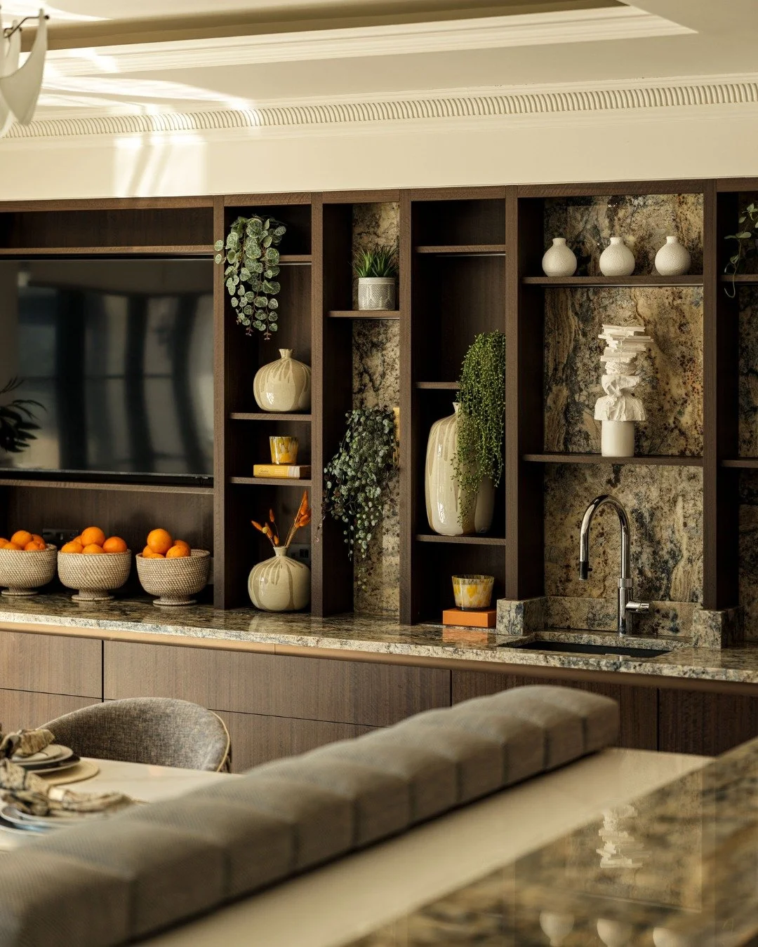 This corner of the kitchen supports the small tasks that happen throughout the day. Open shelving keeps everyday essentials within reach, while the cabinets below anchor the space and keep everything else neatly tucked away.

We also integrated a Quo