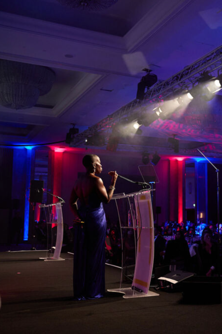 Candice Brathwaite Hosting Awards show in purple dress