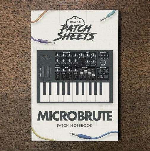 Arturia Microbrute Blank Patch Sheets Notebook on a dark wood desk