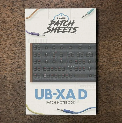 Behringer UB-Xa D Blank Patch Sheets Notebook on a dark wood desk