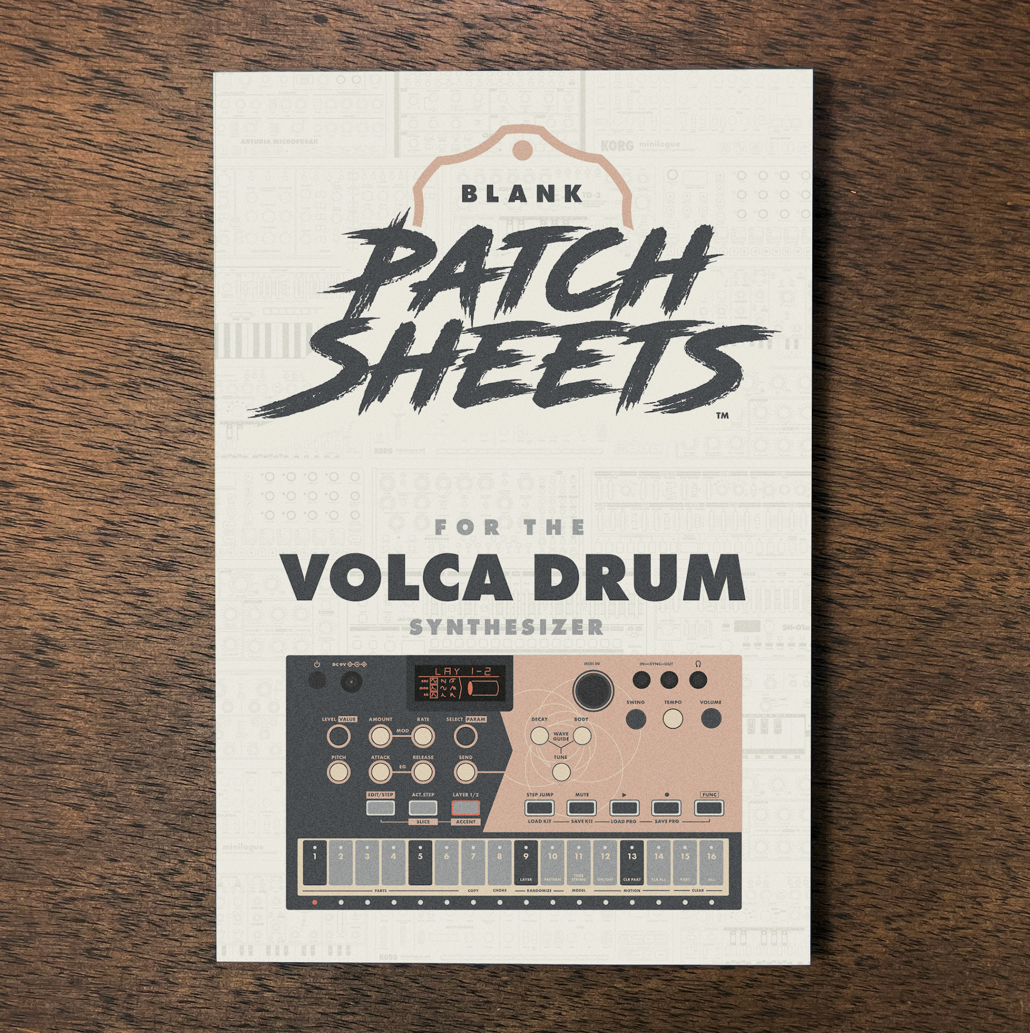 A sheet with printed graphics and text, titled 'Blank Patch Sheets for the Volca Drum Synthesizer,' resting on a wooden surface.