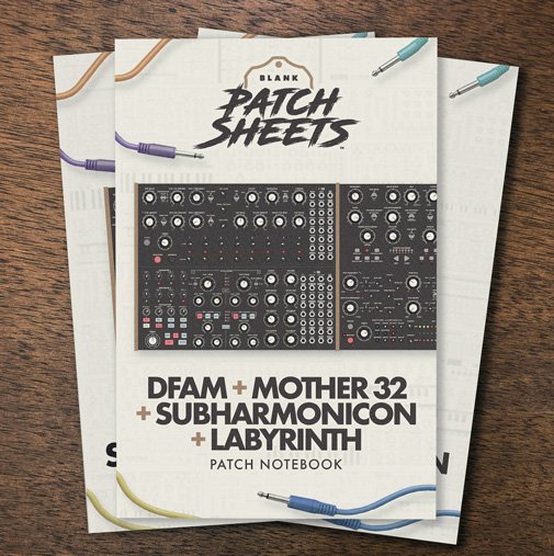 A stack of Moog Studio Bundle Blank Patch Sheets Notebooks on a dark wood desk