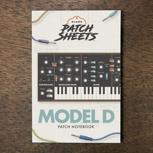 Moog Model D Blank Patch Sheets Notebook on a dark wood desk