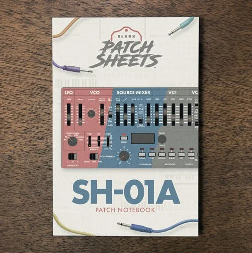 Roland SH-01a Blank Patch Sheets Notebook on a dark wood desk