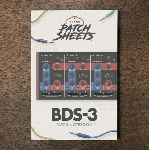 Behringer BDS Blank Patch Sheets Notebook on a dark wood desk