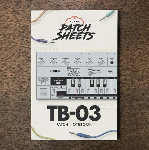 Roland TB-03 Blank Patch Sheets Notebook on a dark wood desk