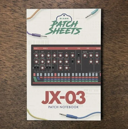Roland JX-03 Blank Patch Sheets Notebook on a dark wood desk