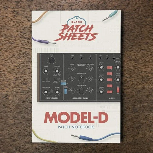 Behringer Model-D Blank Patch Sheets Notebook on a dark wood desk