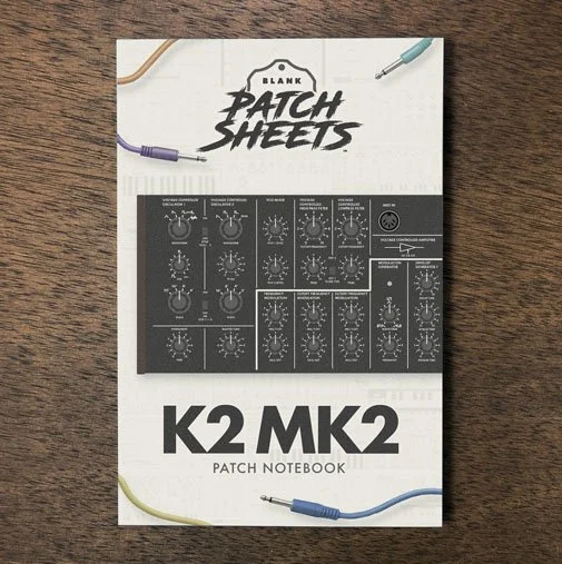 Behriner K2 MK2 Blank Patch Sheets Notebook on a dark wood desk