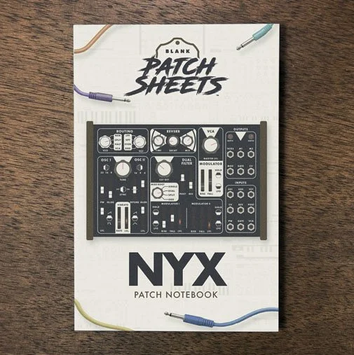Dreadbox NYX Blank Patch Sheets Notebook on a dark wood desk