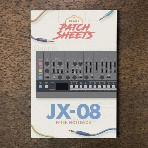 Roland JX-08 Blank Patch Sheets Notebook on a dark wood desk