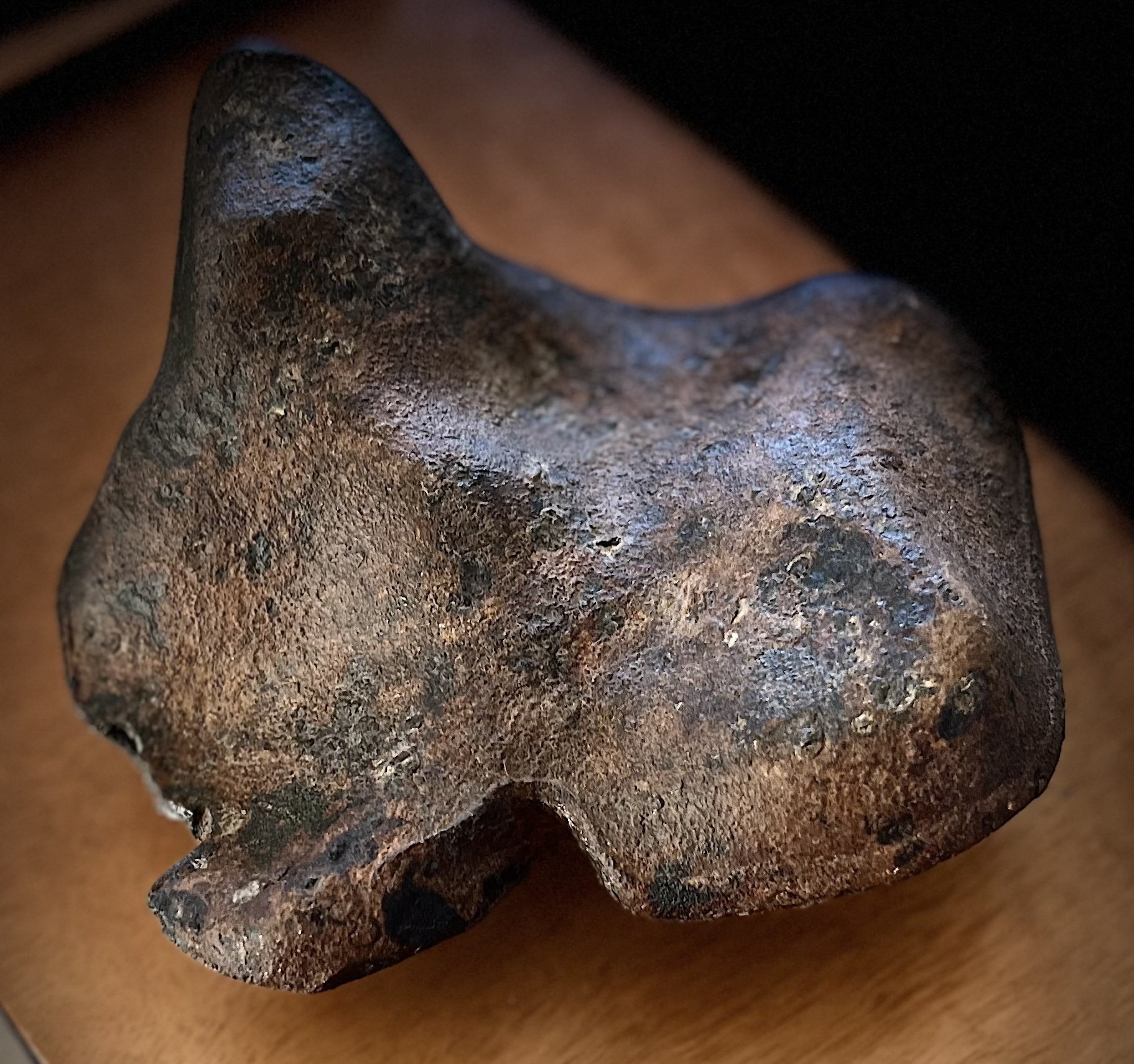Iron meteorite underside with lip and flow lines