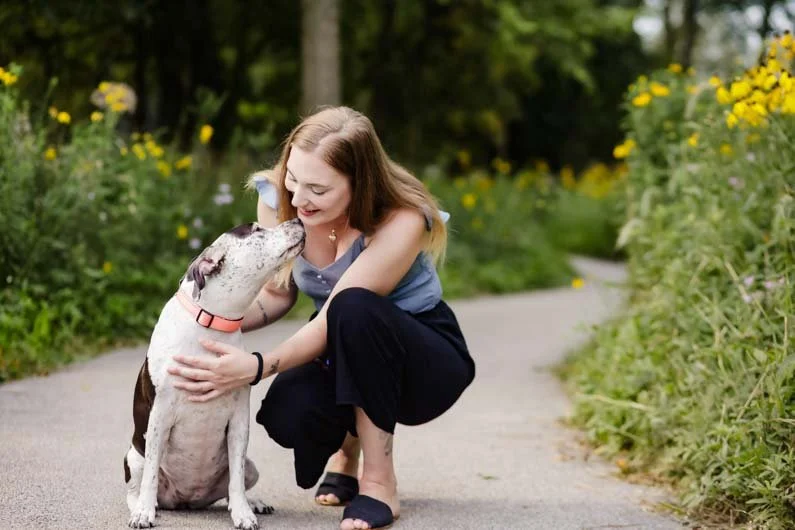 Black_and_White_dog_with_woman.jpg