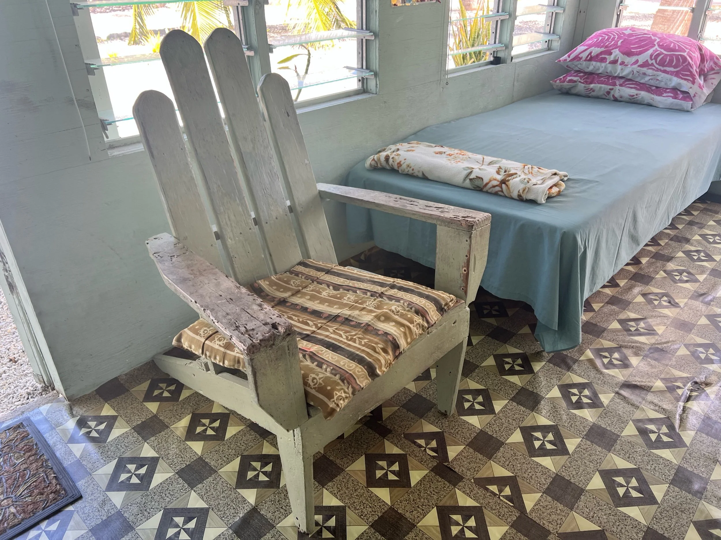  A typical Penrhyn adirondack chair, arm rests are made from worm eaten driftwood. 