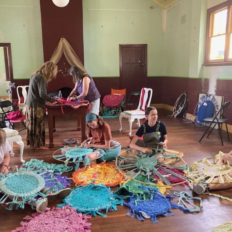Rosie, Katie, Alex &amp; Charlotte sitting yearning with rugs while Sandy and Ali work on the Nannup Music Festival rug.. getting closer to finished