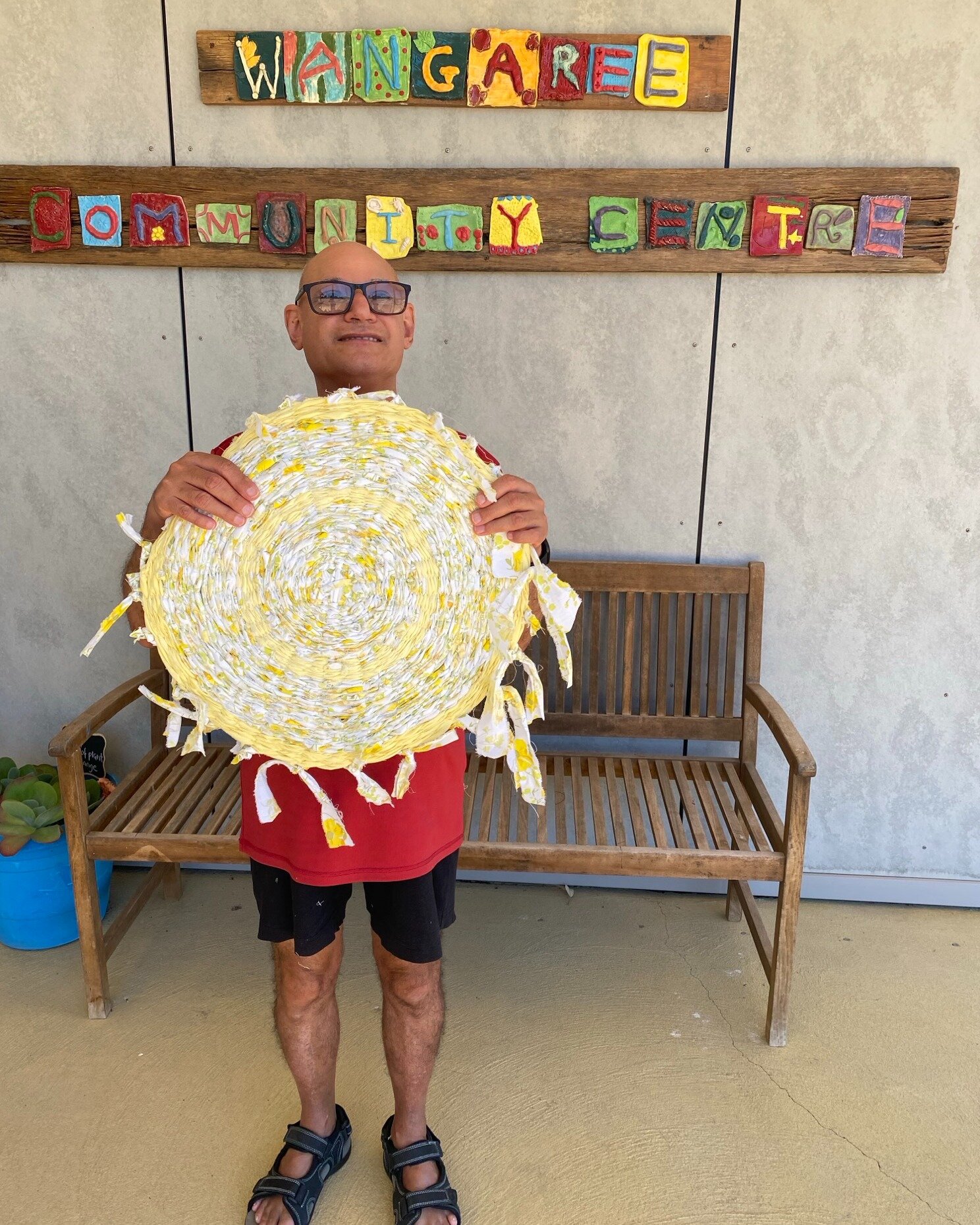 Anthony and his rug: he says: &quot;I wanted to weave a rag-rug for country... my artsworker showed me a rug she started and told me about the project. I wanted to learn to weave and finish it. I used torn up old sheets. Sometimes we would get mixed 