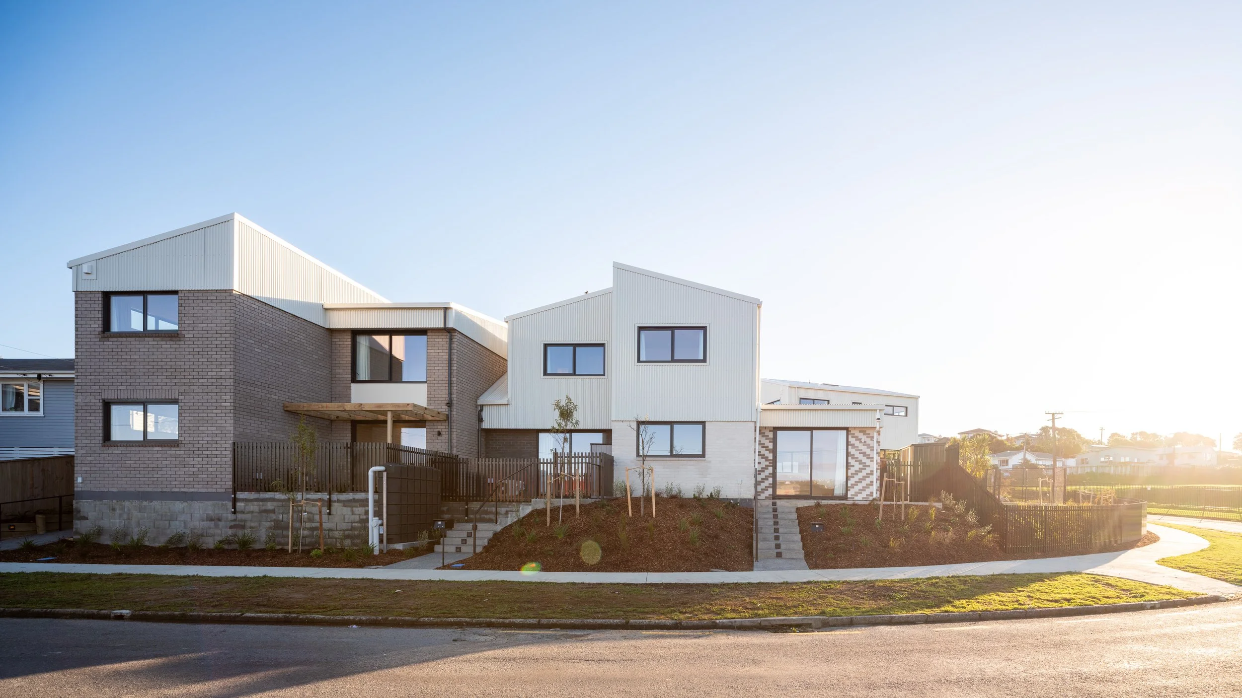Tuki Street homes designed for Te Āhuru Mōwai with private outdoor spaces and connections to the street