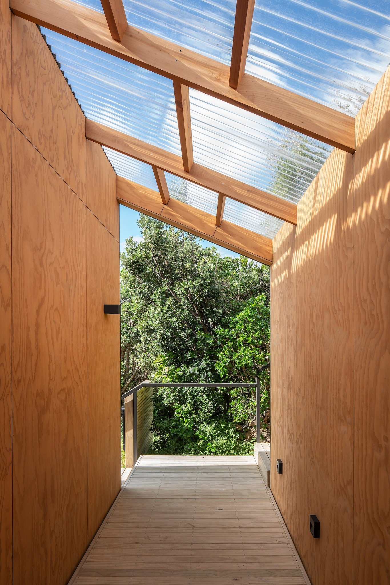 Buckley Road

"On first appearance this is a humble gabled home, but a closer encounter exposes a glowing timber entry porch that has been carved out of the dark exterior fa&ccedil;ade. 

Once inside, the simple planning concept of a long centra