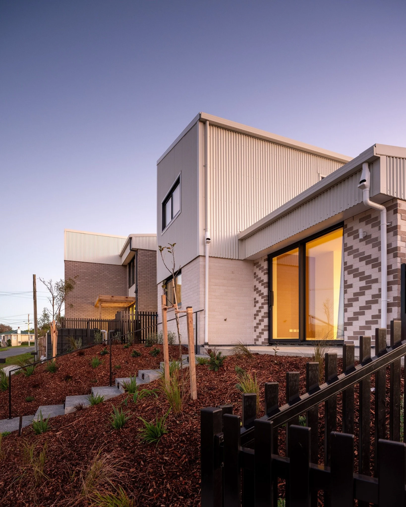 Te Āhuru Mōwai Townhouses | Tuki

Tuki is the second installment of a long term partnership between First Light Studio and Te Āhuru Mōwai, formally established in 2023. These ten homes delivered here form part of a broader programme of more than 50 n